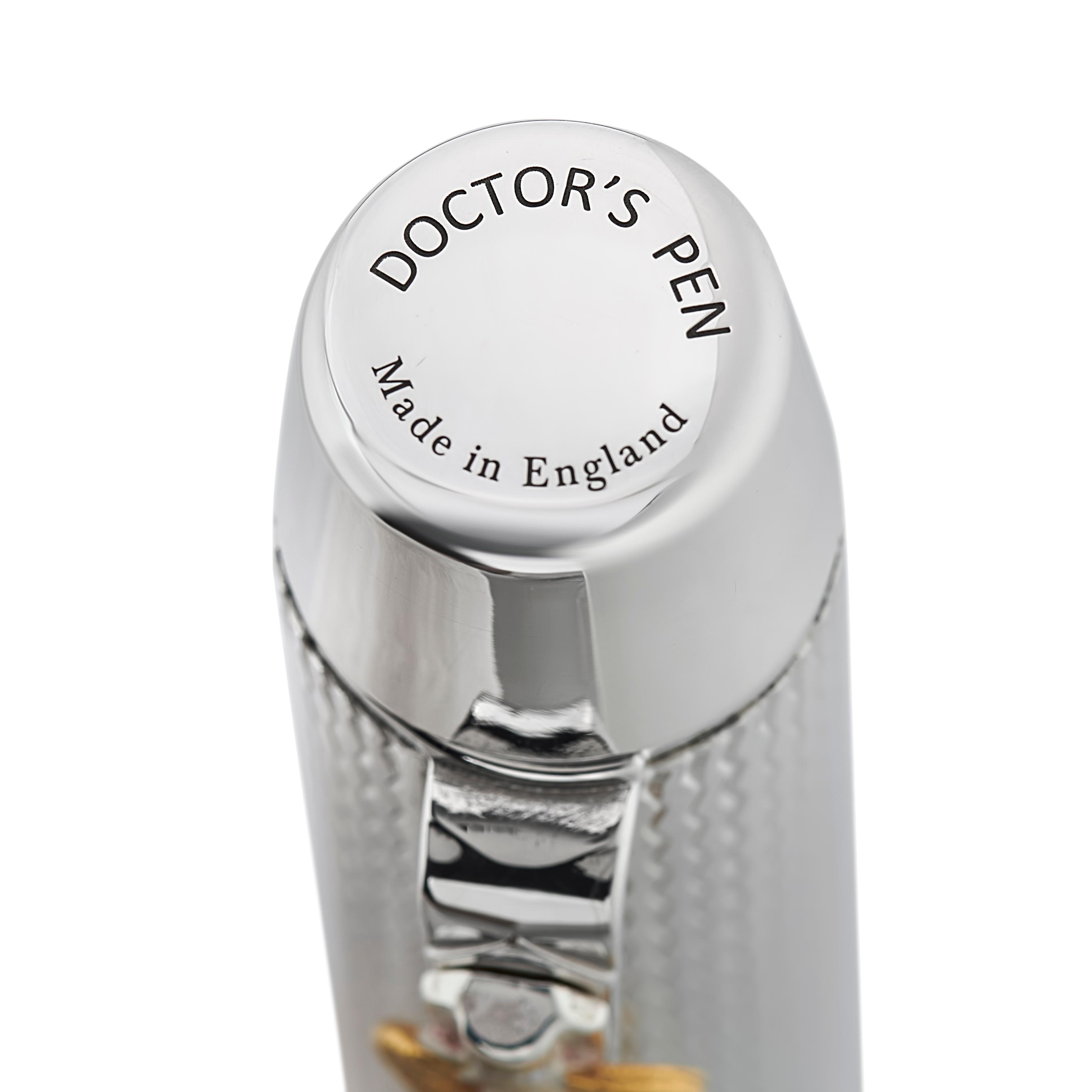 A close-up of a doctor's pen of the sterling silver cap