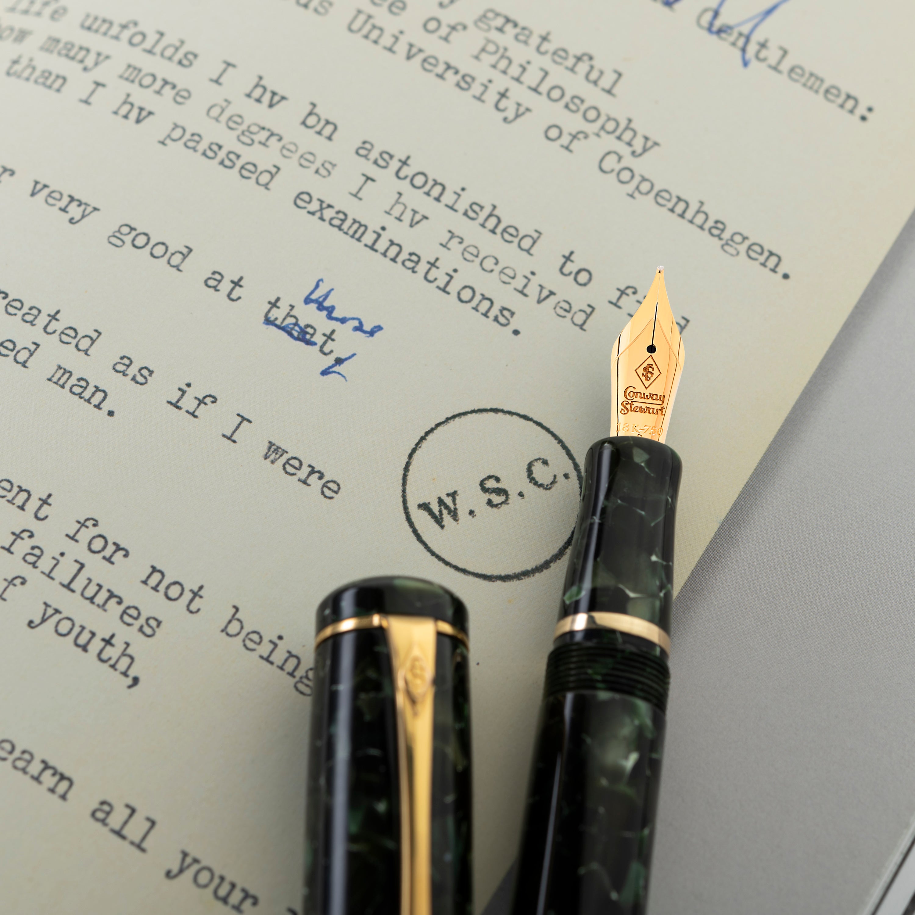 A writing instrument with a classic design, featuring a green barrel and gold accents, named after Winston Churchill