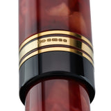 Close-up of the gold cap band hallmark stamped 375 on the Belliver Cherry Red